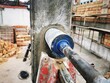 Hole cutting machine. Drilling concrete with an industrial drilling machine with an industrial diamond grain. Core drills used in ring cutters for reinforced concrete columns