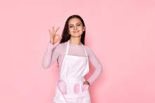 Woman In Chef Apron In Whose Pocket A Whisk And A Spatula