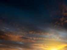 Dramatic Sunset Sky For Design Purpose Of Sky Replacement. Nature Background. Rich Dark Blue And Warm Orange Color Tone.
