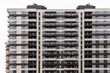 Multi-storey modern new gray residential building against the sky