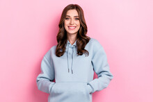Photo Of Adorable Charming Girl Dressed Grey Sweatshirt Smiling Arms Pocket Isolated Pink Color Background