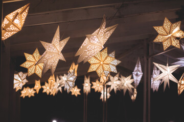 glowing electric decorations in a winter snowy street, with night decor illumination, christmas in e