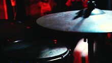 Drum Stick Playing Hihat. Close Up Of Drum Plate Hi Hat And A Drummer Playing On Drums. Top View. Musician Playing Metal Cymbals Close-up. Metal Plate In Blue Lighting. Musical Background With Hihat.