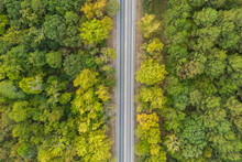 Aerial View From Above Of Country Road Through The Green Summer Forest In Autumn, Broken Bow, Oklahoma, USA. Drone Photography