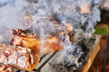 Canvas Print - Lamb steaks are cooked on the grill for serving in catering