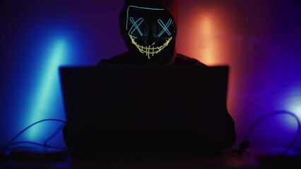 Wall Mural - hacker is working on laptop at night. hands are typing a virus code at keyboard or hacking website. 