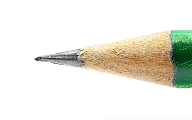 The tip of a black pencil on a white background at high magnification