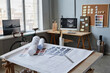 © Seventyfour - Background image of architects office with focus on floor plans, copy space