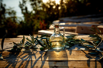 Wall Mural - olive oil and green olive on the wooden background