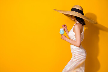 Poster - Photo of adorable slender lady wear white set headwear drinking beverage empty space isolated yellow color background