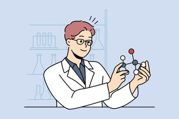 Wall Mural - smiling male scientist working with atom model in laboratory. happy man researcher in uniform busy i