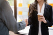 © NINENII - Business women shake hands after agreeing to start a new project successfully.