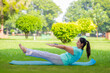 © Niks Ads - Beautiful indian woman doing yoga exercise in the park.