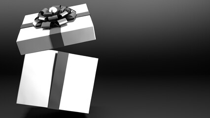 Falling white gift box with black ribbon and bow isolated on black background and copy space. Flying gift box, giving present, black friday, Christmas, birthday, shopping banner, sale concept.