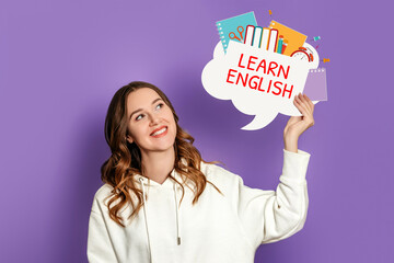 student girl holding speech bubble with text learn english and illustration isolated on lilac background
