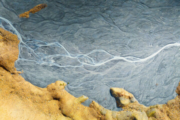 Wall Mural - Drone view of the river in the glacier valley. View of the moraines. Landscape from the air.  River on a moraine. Landscape with soft light before sunset. Abstract view for wallpaper. Alberta, Canada.