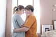 © ND STOCK - Asian lesbian couple, LGBTQ. Happy Two young Asia women showing love and romance together at home. Positive mood and moment of LGBT lesbian.