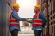 © Suriyo - Team African American worker concept, African American worker teamwork  working in warehouse containers for logistic import export, team Black man worker shake hand