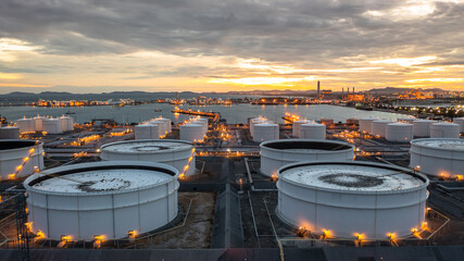 Aerial view oil and gas storage tank farm, Tank farm storage petrochemical petroleum chemical refinery product at oil terminal, Business commercial trade fuel and energy transport tanker ship vessel.