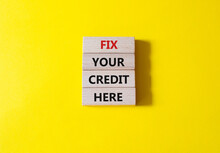 Fix Your Credit Here Symbol. Concept Words Fix Your Credit Here On Wooden Blocks. Beautiful Yellow Background. Business And Fix Your Credit Here Concept. Copy Space.