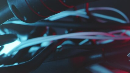 Wall Mural - tracking shot of tangle of different cables and adapters in technical light