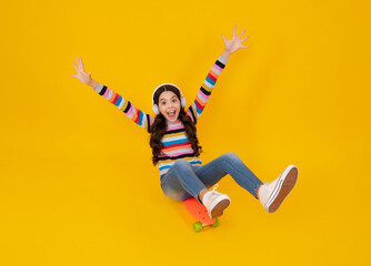 Poster - Teen school girl with skateboard on studio isolated background. Schoolgirl trend, urban teenager style. Happy teenager, positive and smiling emotions of teen girl.