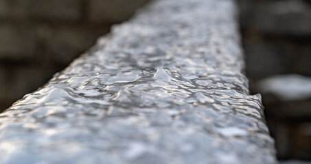Wall Mural - Frozen ice on the railings close up. Ice in winte