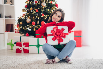 Poster - Photo of positive pretty lady wear red ugly jumper sit floor fluffy carpet look up imagine plan idea unpack open gift now before xmas eve