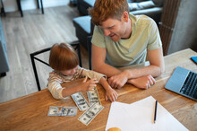 Dad Explaining His Son The Importance Of Financial Literacy