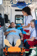 © zinkevych - Paramedical team providing emergency medical care to an ill person