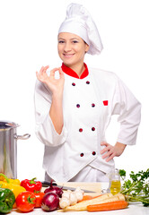 Wall Mural - Woman chef cooking soap with different vegetables  isolated on white background