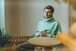 © lithiumphoto - Thoughtful young man sitting in the cafe with cup of coffee
