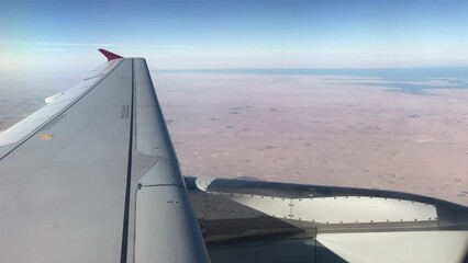 Poster - Airplane flying over the desert