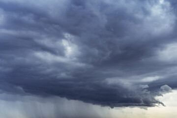 Wall Mural - dark stormy sky with rainy clouds. heavy rain is coming.