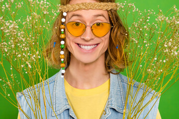 Wall Mural - Cropped view portrait of attractive cheerful hippie guy wearing nice look isolated over bright green color background