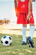 Fitness, soccer kid or hamstring pain on soccer field for workout exercise, training or football training match. Health, wellness or injured soccer player for muscle injury, leg or medical emergency
