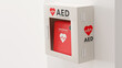 © kj - 白い壁に取り付けられたAED（救命除細動器）のフォトリアルな3Dレンダリングイラスト