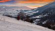 © Pellinni - carpathian rural landscape in winter. beautiful sunrise in mountains. snow covered hills. scenery with krasna ridge in the distance. synevir village in the valley