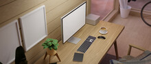 Wooden Workspace With PC Desktop Computer On Wooden Table Against The Wood Plank Wall
