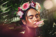 © Allistair F/peopleimages.com - Beauty, skincare and flower with natural fragrance, flower and luxury wellness from nature with green forest background. Woman model with plant advertising cosmetic skin product with a flowers plant