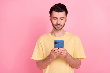 Wall Mural - Photo of virile attractive man use modern device gadget typing friends colleagues isolated on pink color background