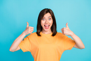 Sticker - Photo of crazy impressed overjoyed girl straight hair wear yellow t-shirt showing thumbs up open mouth isolated on blue color background