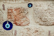 © Golden Shark - Large blue  bead on brick wall in Turkey