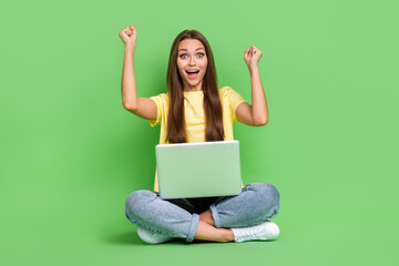 Sticker - Photo of astonished positive stylish lady raise hand fist rejoice pass online exam shout hooray yes isolated on green color background