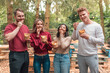 © Carlo - group of friends standing with paper cone with french fries at kiosk