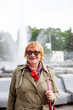 © DariaTrofimova - Old woman in stylish clothes   walking on   street.