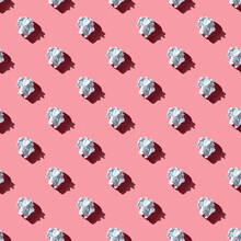 Seamless Pattern Of Crumpled White Paper Ball On A Pink Background With Hard Light