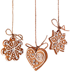 Wall Mural - three christmas gingerbread cookies decoration hanging isolated