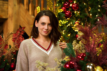 Woman in living room celebrating Christmas