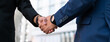 © Gonzalo - successful contract negotiate and handshake concept, two businessman shake hand with partner to celebration partnership, teamwork, business deal in room meeting after success communication, agreement